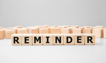Poster - Word REMINDER made with wood building blocks