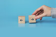 © fidaolga - Wooden cubes with drawings of left and right arrows. The choice of a person's life path