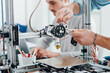 © StockPhotoPro - Young researchers and 3D printing