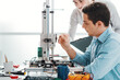 © StockPhotoPro - Engineering students using a 3D printer