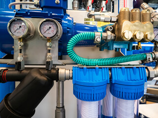 Poster - Equipment of an industrial enterprise. Blue compressor, pressure gauges and pipes. Packaging production. Production equipment. Machines in the shop.