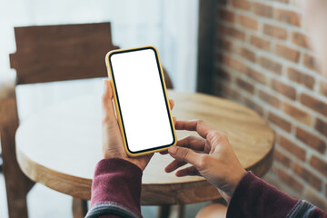 cell phone blank white screen mockup.woman hand holding texting using mobile on desk at office.background empty space for advertise.work people contact marketing business,technology