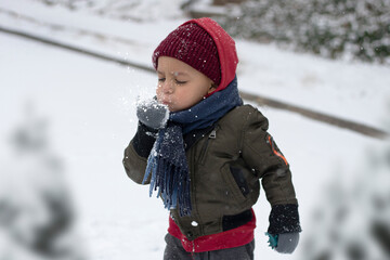 Boy Blowing Snow