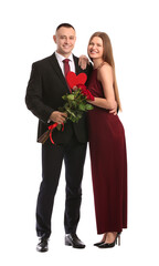 Canvas Print - Young couple with flowers and red heart on white background. Valentine's Day celebration