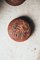 Two healthy brown sugar cinnamon cake on textured natural stone background. The image shows crumbs and texture.