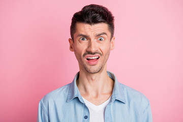 Sticker - Photo of shocked irritated young brunette man negative reaction isolated on pastel pink color background