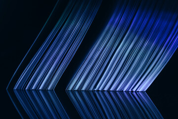 Fototapete - Close up Beautiful book pages in the blue light on a night. Background pattern for design. Macro photography view.