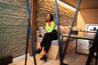 © AS Photo Family - Fashionable african american woman in a light green top and black pants pose.