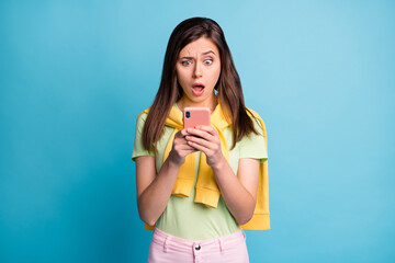 Sticker - Portrait of lovely disappointed funky girl using gadget reading fake news omg isolated over bright blue color background