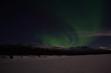 aurora borealis, northern light on winter night sky in northern norway