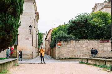 Girl in yellow jacket street photography Spain