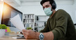 Busy businessman wearing facemask reading and check on business paper carefully in office