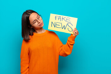 Wall Mural - young latin woman fake news concept