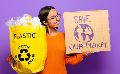 Wall Mural - young hispanis woman. recycle concept