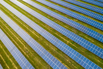 Industrial landscape with blue solar panels. Photovoltaic modules for renewable energy.