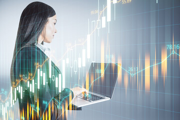 Aufkleber - Businesswoman using laptop with stock analytics interface