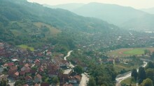 Aerial Flyover Of The Valley Town Of Ivanjica, Serbia On A Bright Day.