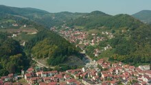 Aerial Flyover Shot Of The Valley Town Of Ivanjica In Serbia On A Bright Day.
