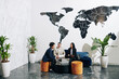 © DragonImages - Multi-ethnic group of business people meeting in office to discuss work progress, check reports and sign agreements