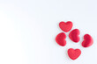 Red hearts on white background for Valentines day. Top view with copy space.