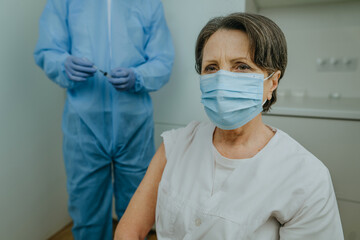 Healthcare worker waiting for COVID-19 vaccination at hospital