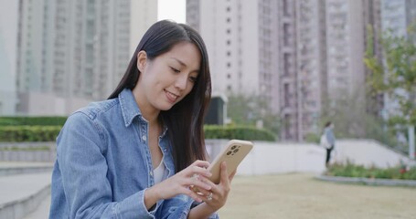 Canvas Print - Woman use of smart phone at park