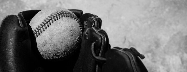 Sticker - Old used baseball closeup in leather glove with rustic sports black and white style.