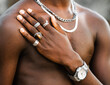 © Albert Morcillo/ADDICTIVE STOCK - Unrecognizable crop African American male with naked torso showing hand with trendy silver rings