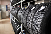 Assortment Of Tires For Car In Repair Garage, Replacement Of Winter And Summer Tires. Seasonal Tire Replacement Concept.