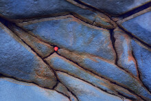Texture, Patterns And Colors On A Cliff Of A Beach In Asturias. The Red Stone Seems Like A Heart Of The Cliff