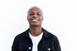 © David Munoz/ADDICTIVE STOCK - Satisfied African American male in casual outfit smiling and looking at camera on white background