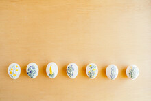 Top View Of Chicken Eggs Painted With Aquarelle Placed On Table For Easter