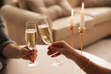 People Clinking Glasses With Champagne At Home, Closeup