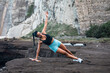 © Pablo Garcia/ADDICTIVE STOCK - Determined female athlete balancing in side plank while doing exercises during workout at seaside