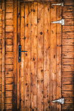 Weathered Wooden Door Of Aged Cozy Residential House Located In Countryside In Daytime