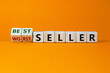Worst or best seller symbol. Turned wooden cubes and changed words 'worth seller' to 'best seller'. Beautiful orange background, copy space. Business, worth or best seller concept.