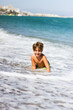 © Emilio - a very happy child playing with the waves of the sea