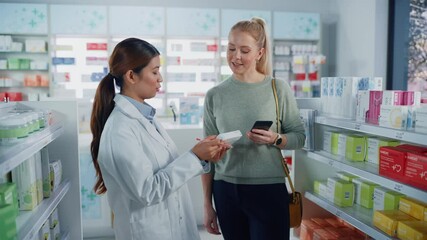 Wall Mural - Pharmacy Drugstore: Caucasian Woman Chooses to Buy Medicine Professional Asian Pharmacist Advising, Consulting, Recommending Customer the Best Option. Modern Pharma Store Health Care Products