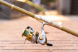 fishing on a sunny day, golden carbon fishing rod, fishing pole on the floor