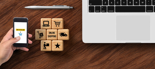 Wall Mural - cubes with shopping icons and office equipment on wooden background