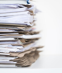 Extremely Close up Stack of Documents Folders on Office Desk Waiting to be Completed.