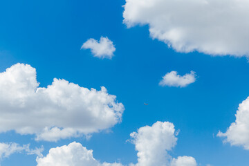Wall Mural - blue clear sky with white fluffy clouds. natural background