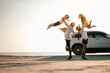 © Garun Studios - Asian family vacation holiday,Happy family, parents holding children flying in the sky.Concept family and Holiday and travel.