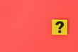 © TeacherPhoto - Question mark drawn on wooden board over red background with copy space.