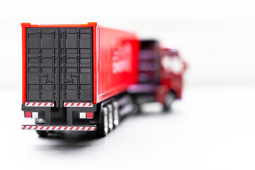 Wall Mural - Container truck selective focus on white background, Trailer container truck parking at warehouse, Global business logistic and transportation shipping company.