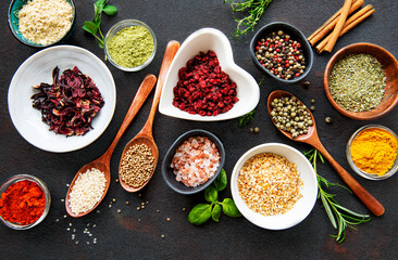 Sticker - Various spices in a bowls on a black