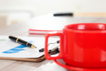 Wall Mural - A cup of coffee and documents and signature pen