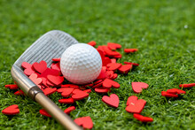 Golf Putting With Love By Iron On Green Grass