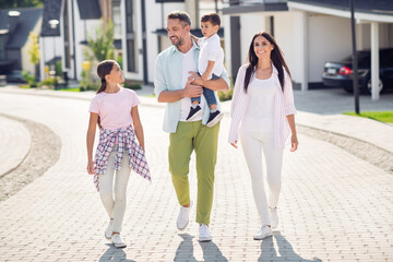 Wall Mural - Full length body size view of nice cheerful friends dad mom small little kids going spending sunny day holiday free time outside cottage