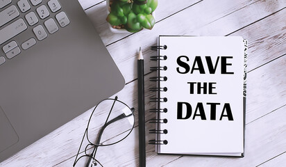 Poster - Save The Data text on the notebook with office background